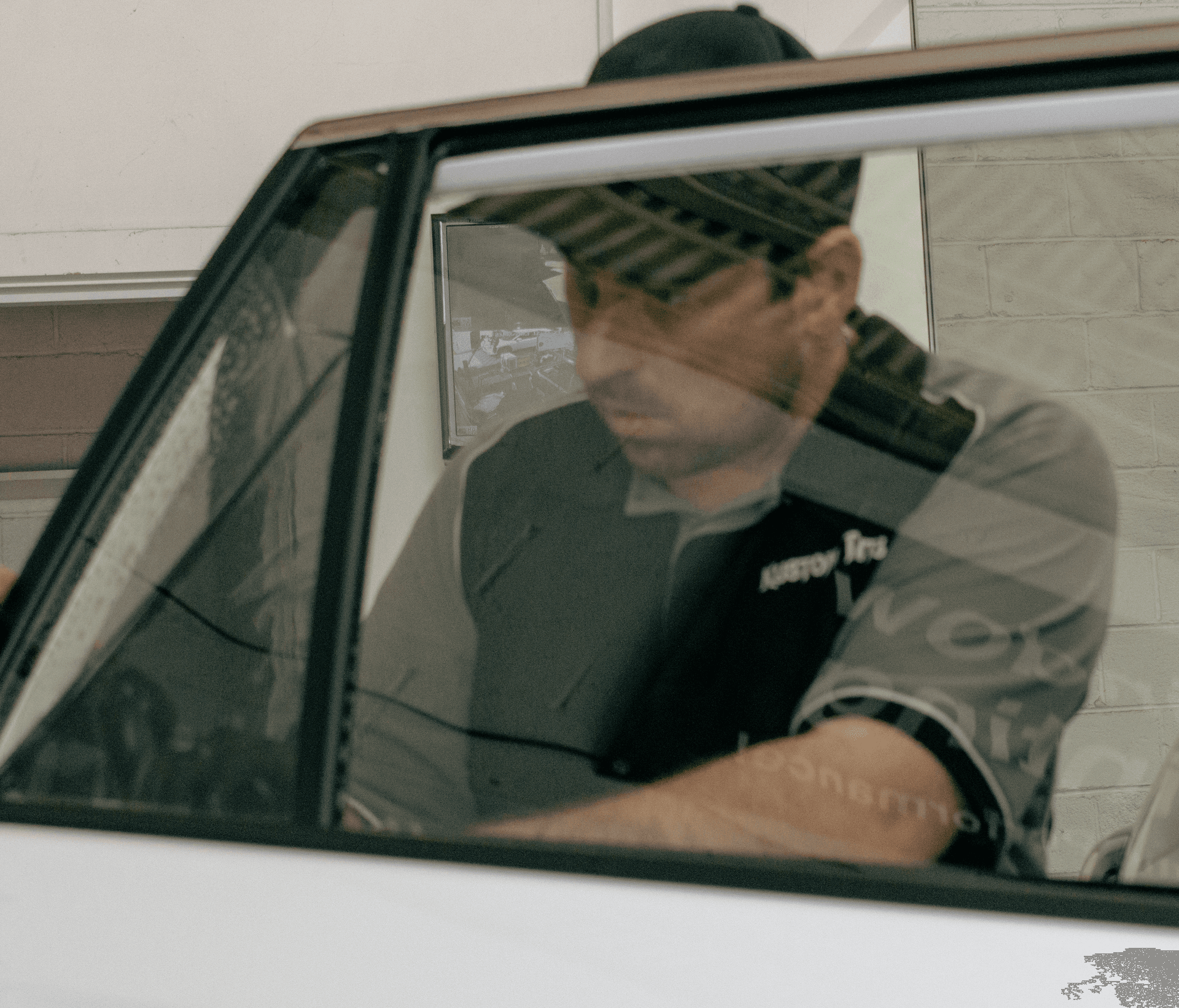 Kustom Tints technician applying window tint